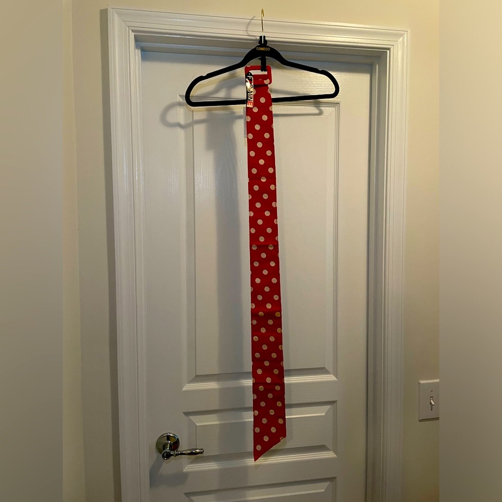 Sassy COMECO red belt with white polka dot. 42 in at longest. Disney? Pin up?
